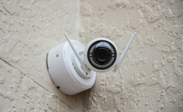 Security camera mounted on a wall